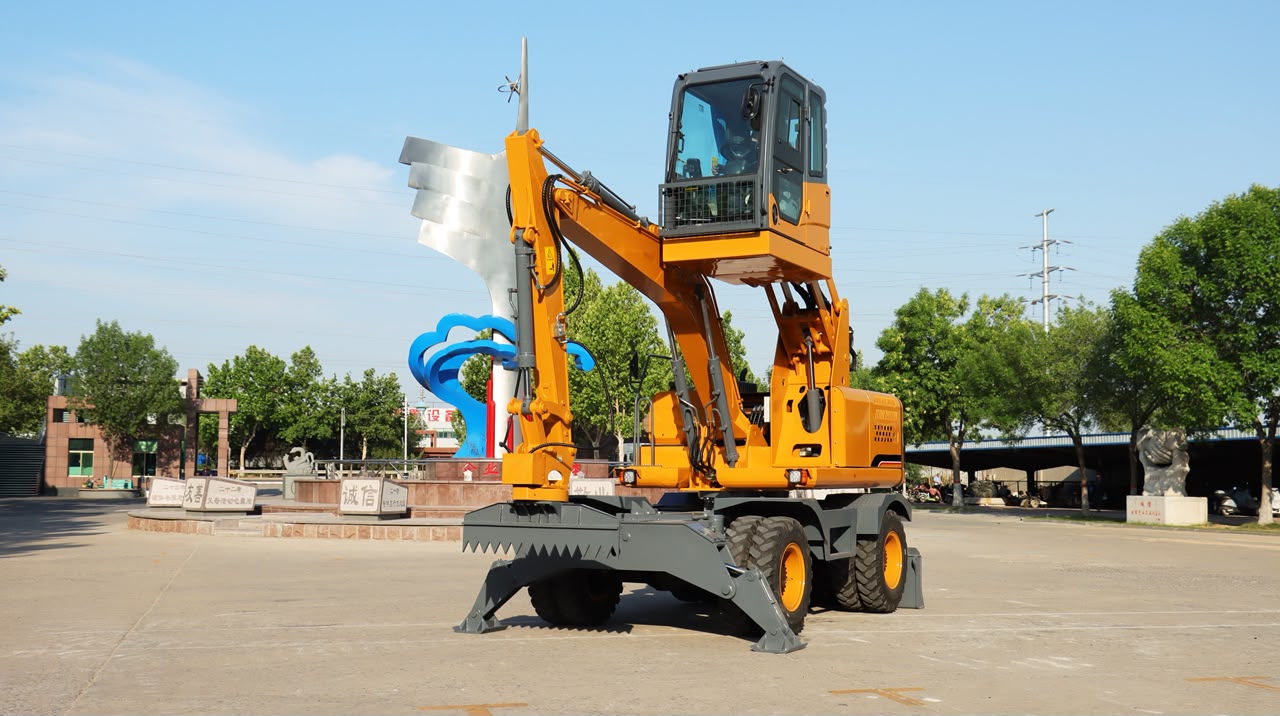 Excavateur sur pneus PRC100 cabine et bras hydraulique en position de travail